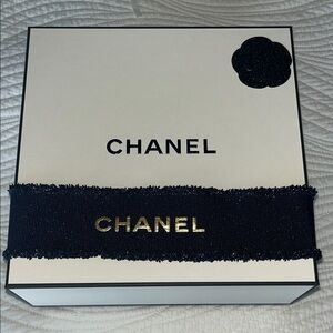 Chanel box with navy blue metallic ribbon